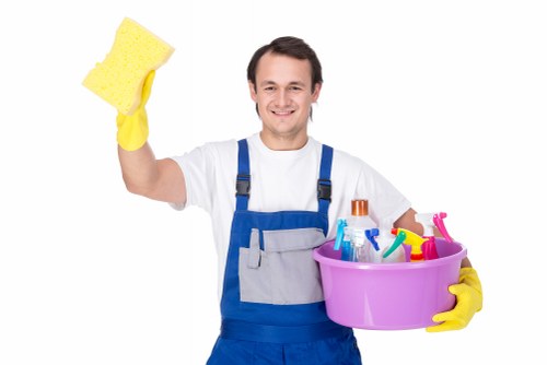 Professional cleaner maintaining shared hallway floor